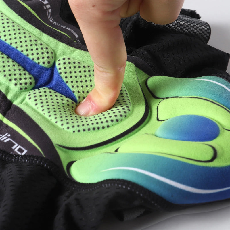 Close-up of a green and blue shoe with a person's finger pressing on the mesh area.