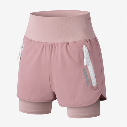 A pair of dusty pink double-layer running shorts with a zippered side pocket and a vertical 'WOSAVE' logo, shown on a light gray background.