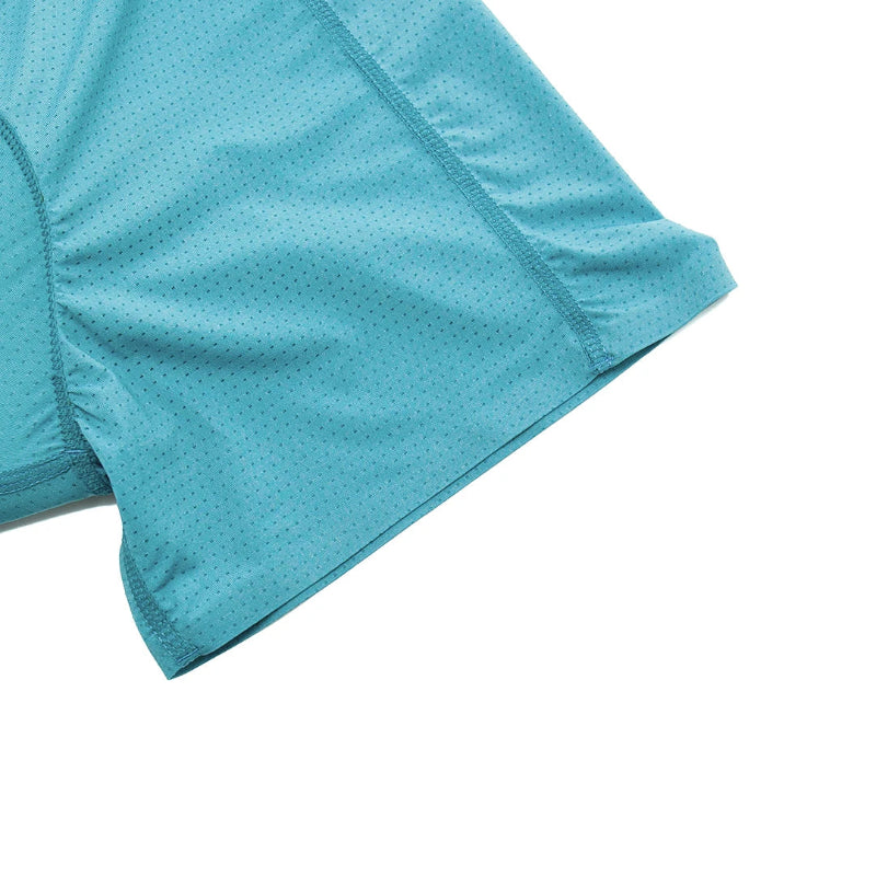 Close-up of a blue athletic shirt with a white background