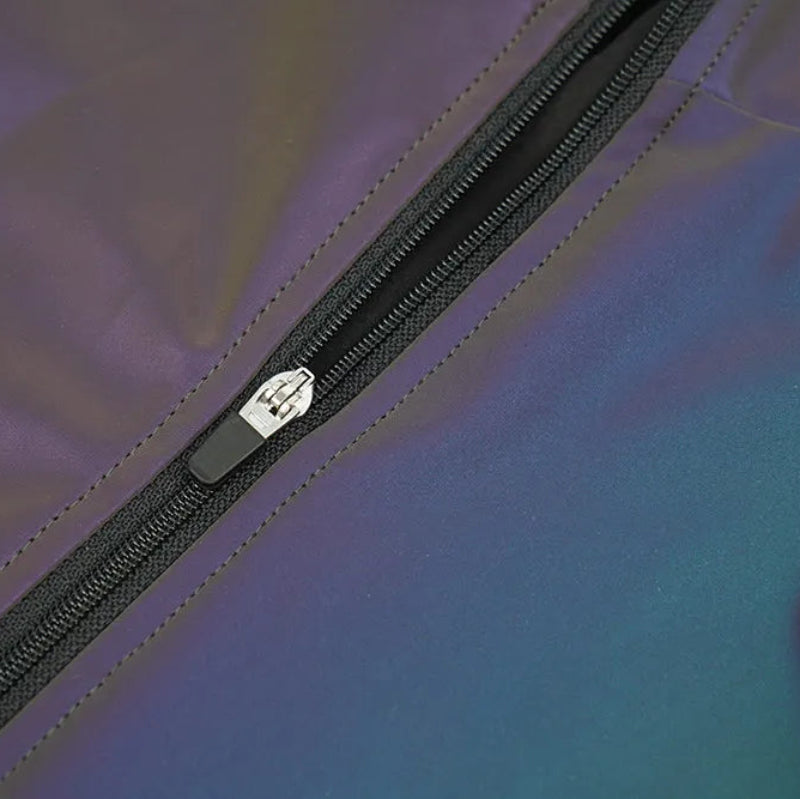 Close-up of a zipper on a multicolored fabric background