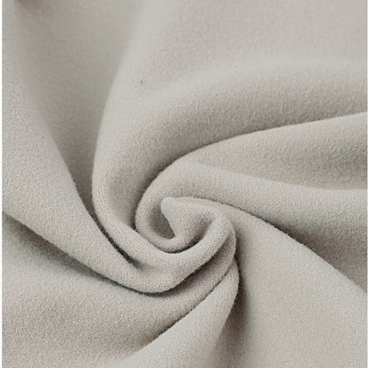 Close-up of beige fabric with a soft texture