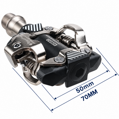 A carbon fiber bicycle pedal with metallic silver and black components, overlaid with blue dimension lines indicating a 50mm and 70mm length.