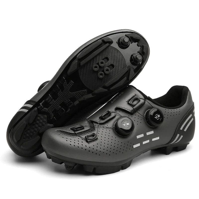 Pair of black cycling shoes on a white background