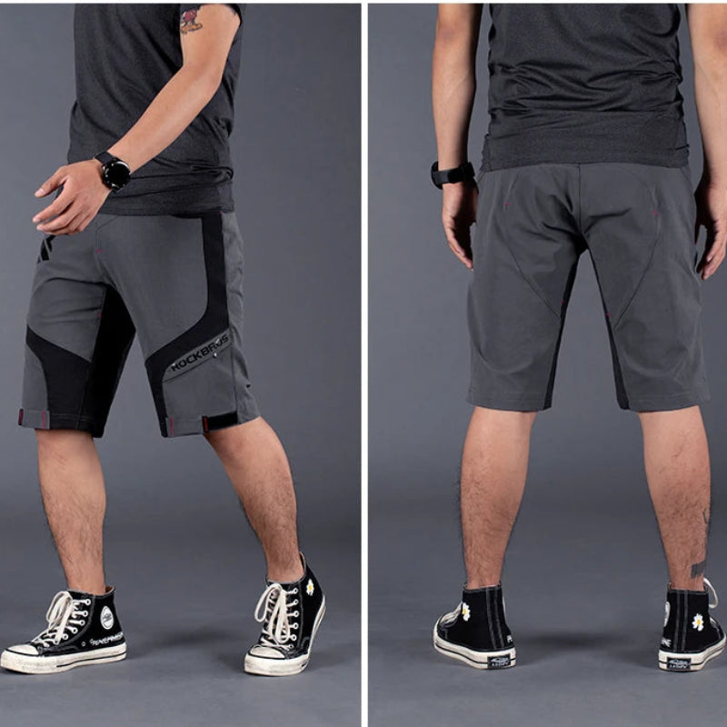 A promotional composite showing a man modeling gray and black riding shorts from the front and back against a dark gray studio background. Text at the top reads 'Multi-angle real shot' and 'Not only riding, but also day wear.