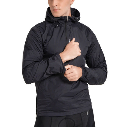 Person wearing a black jacket with a hood on a white background