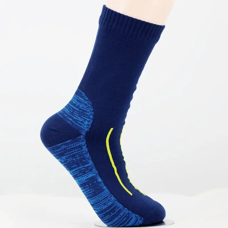 Blue socks with a yellow accent on a white background
