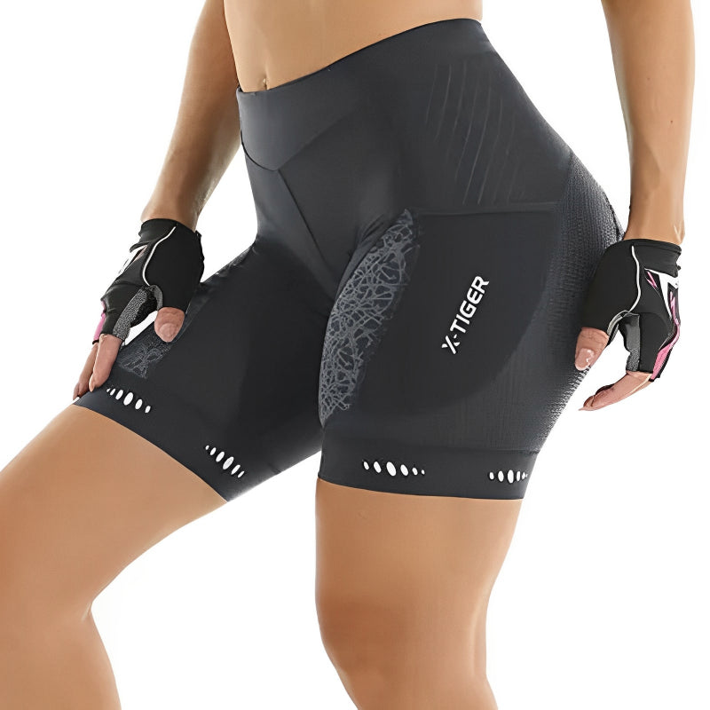 Black cycling shorts branding on a white background
